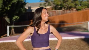 woman posing with confident body language after playing pickleball.
