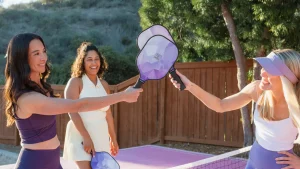 example of how to build healthy habits, woman playing pickleball.