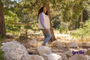Woman walking in forest for low impact cardio