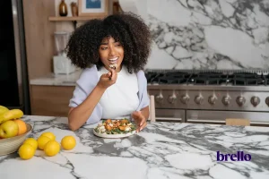 Woman eating chicken salad, example of GLP-1 lunch ideas.